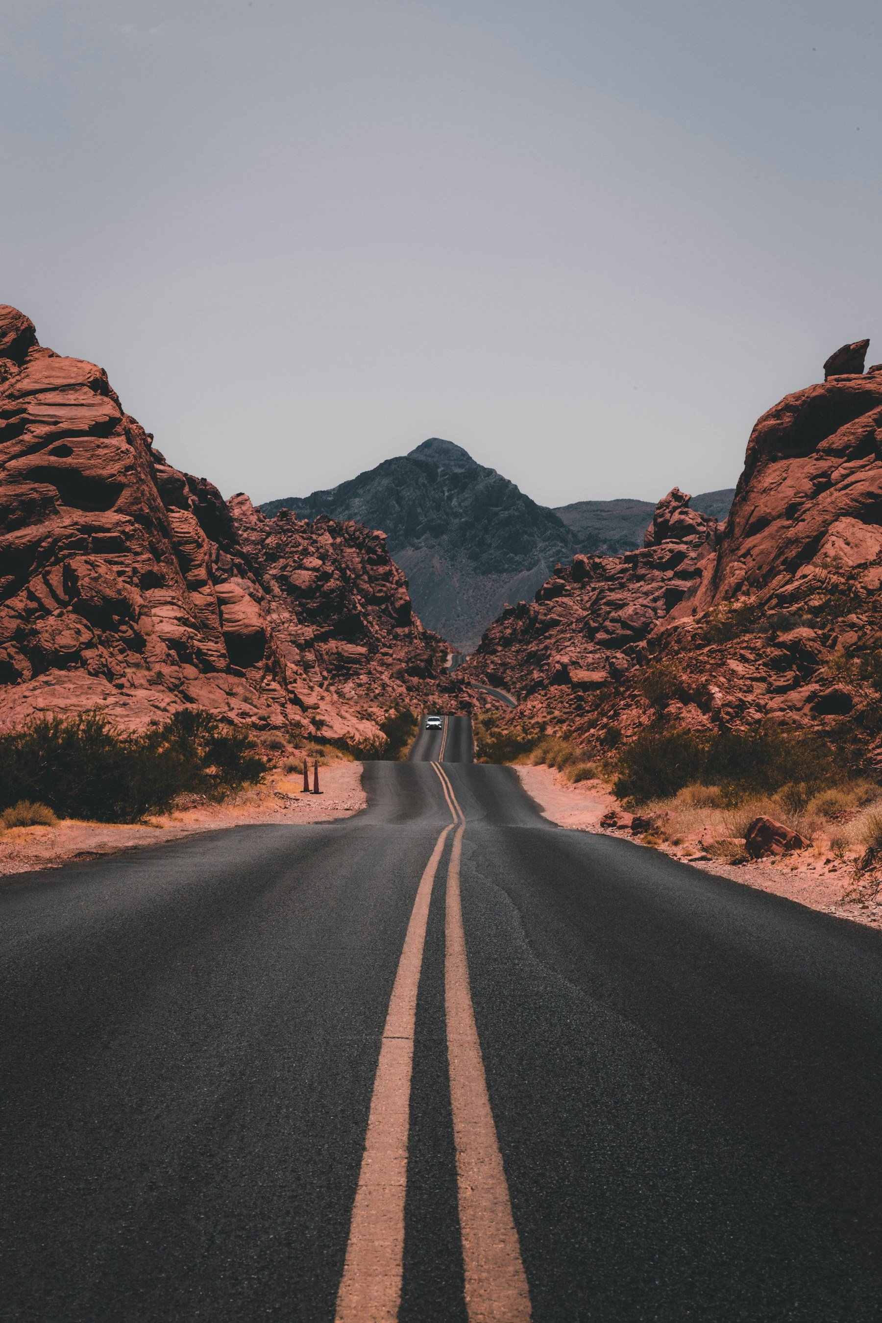 Road winding between red-rock cliffs