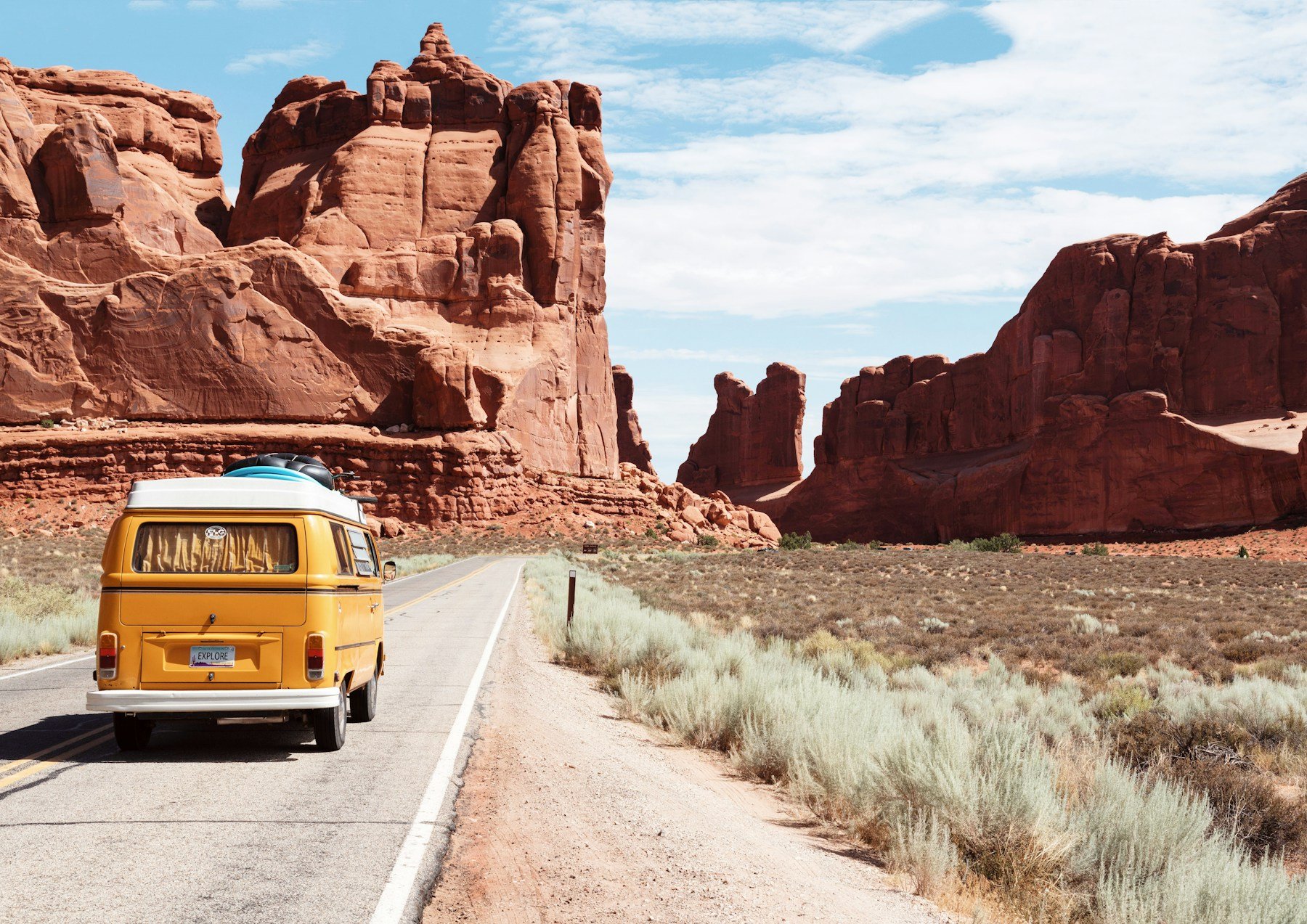 Vintage van traveling through Monument Valley